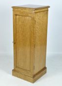 A 20th century maple veneered cupboard,