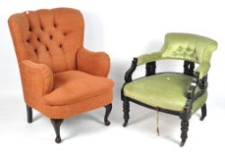 A Victorian armchair and a contemporary armchair,