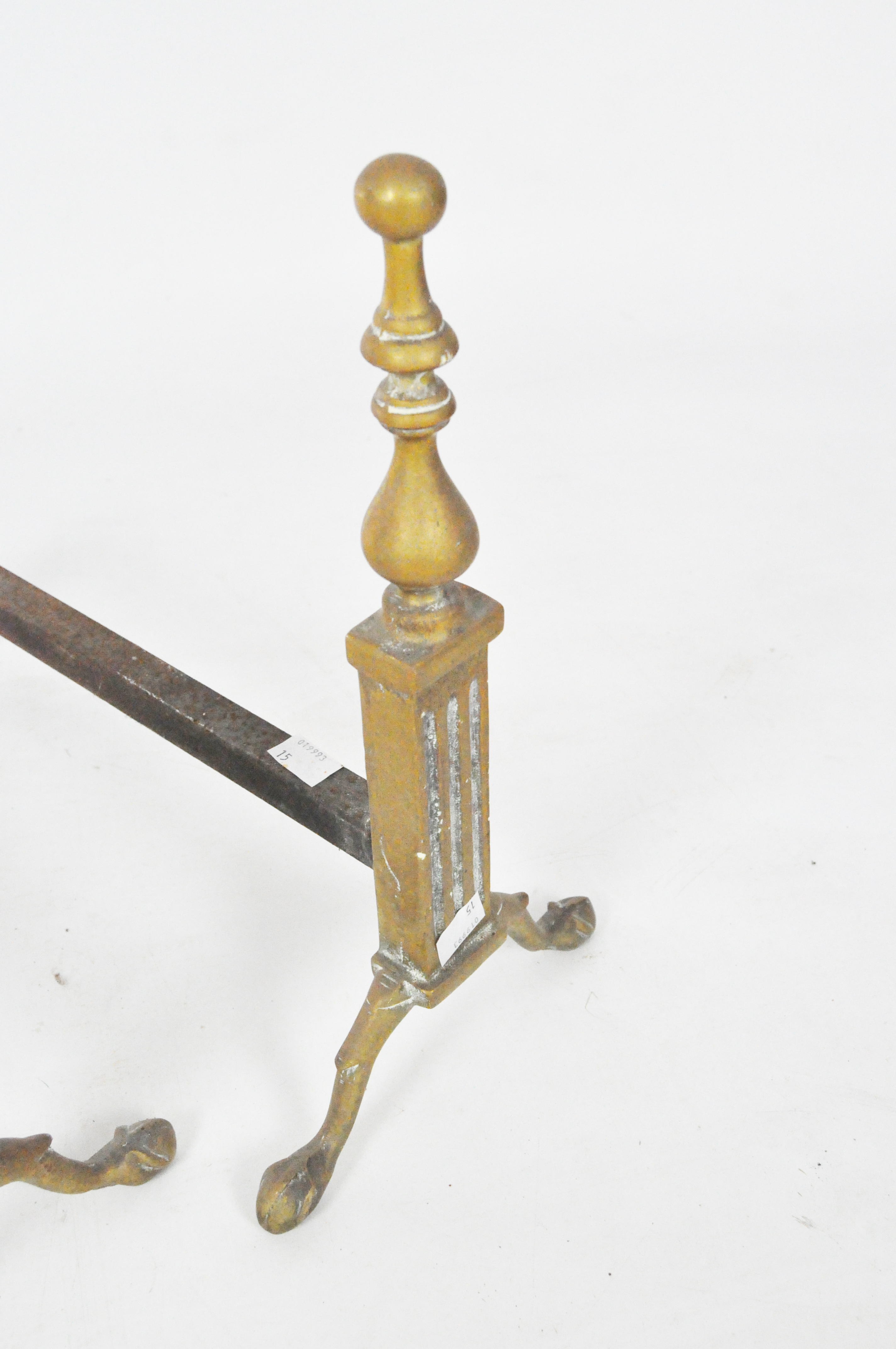 A pair of early 20th century fire dogs, with brass baluster finials and claw feet, - Image 2 of 2