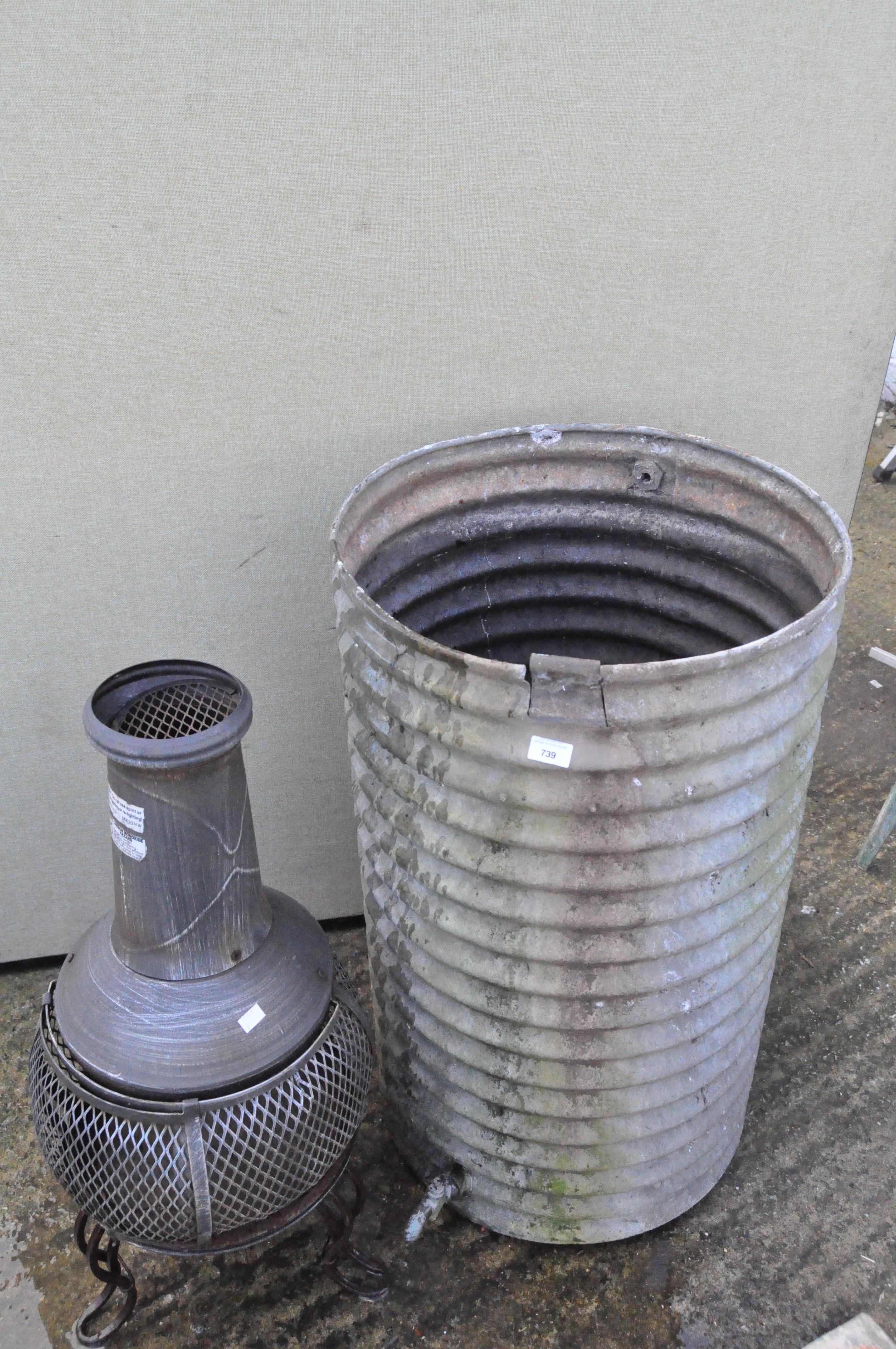 Early galvanized metal garden water butt of cylindrical form,