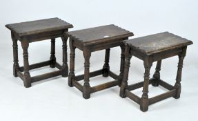 Three wooden footstools,
