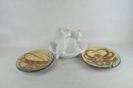 Three ceramic dishes to include one glazed in white and moulded with five doves,