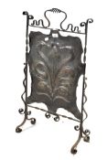An Art Nouveau copper and wrought iron fire screen,