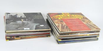 A selection of vinyl records, mostly featuring classical music and brass marches,