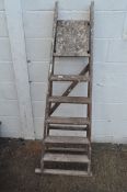 A set of wooden step ladders,