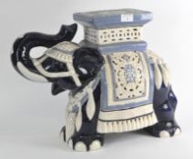 A large glazed ceramic jardiniere stand in the form of an Asian elephant,