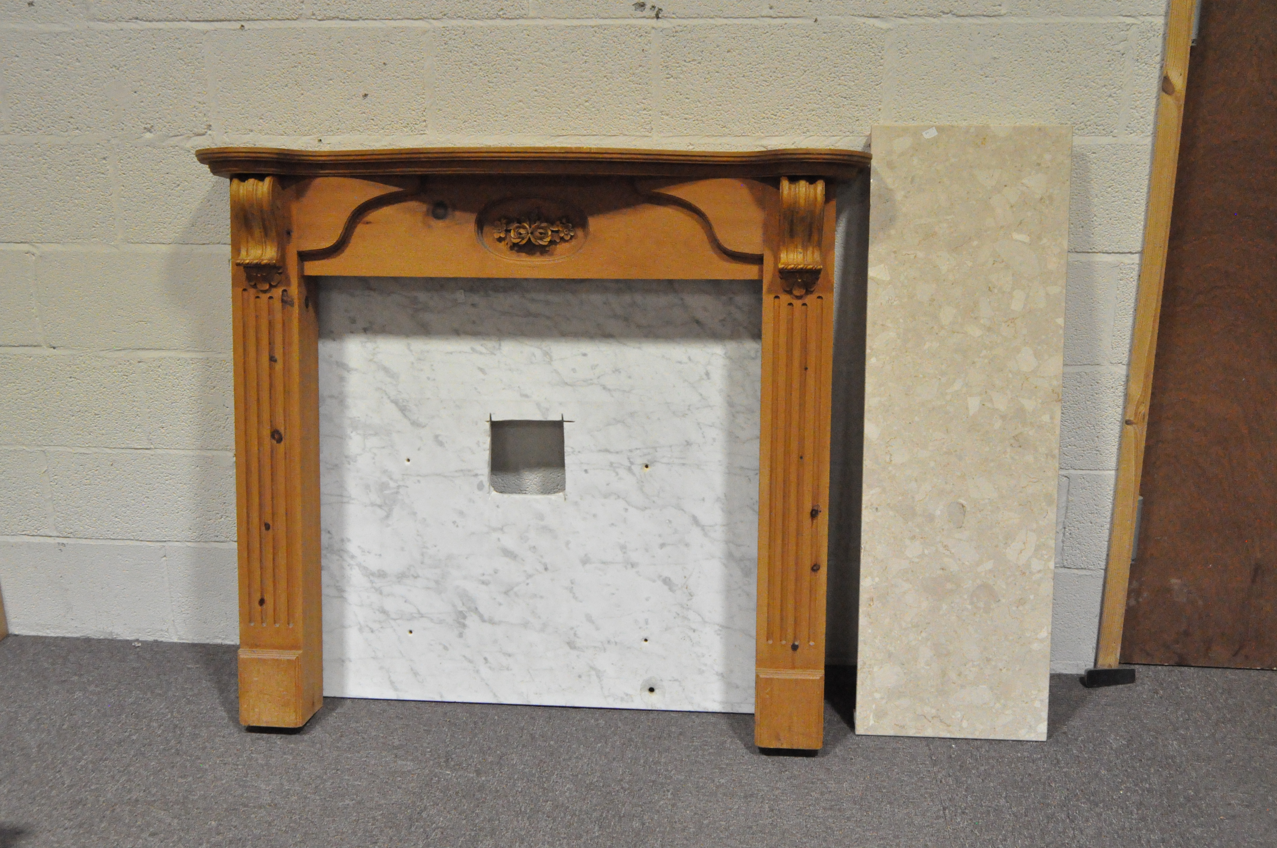 A modern pine fireplace surround,