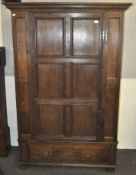 A panelled oak wardrobe, constructed of elements dating from the 19th century and later,