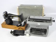 A 20th century Singer electric sewing machine and an Underwood Five vintage typewriter