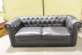 A two seater chesterfield sofa,