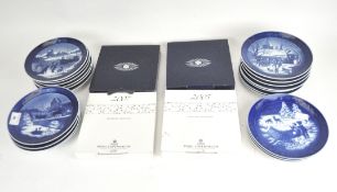 A collection of Royal Copenhagen ceramic plates, in blue and white,