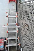 A large pair of aluminium step ladders. 200cm folded plus one unassembled example.