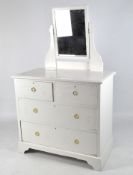 A 20th century dressing table, the rectangular top supporting a hinged mirror,