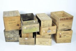 A collection of twelve vintage wooden wine crates,