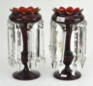 A pair of red glass table lustres,