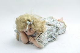 A vintage Albion porcelain blond haired doll,