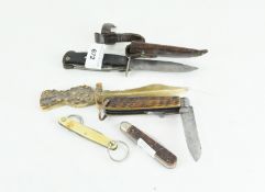 A selection of assorted knives, inlcuding a WWII era German multi tool knife,