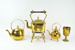 Three 19th & 20th century brass kettles and a goblet,