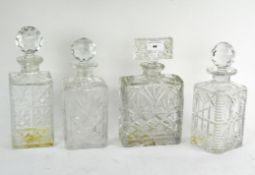 Four moulded glass decanters,