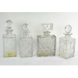 Four moulded glass decanters,