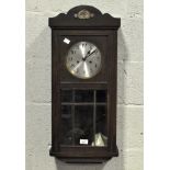 An early 20th century wall clock,