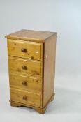 A contemporary narrow pine chest of drawers,