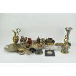 A selection of oriental collectables, including brass chargers, three bells, candlesticks,