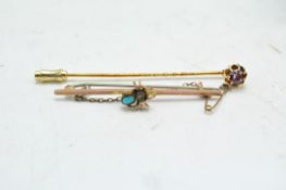 A Victorian 9ct gold bar brooch and yellow metal stick pin,