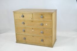 A Victorian stripped pine chest of drawers,