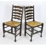 Two ladderback dining chairs with rush seating,