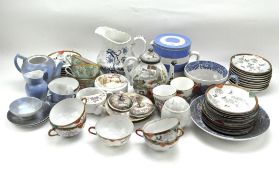 A collection of assorted teasets,