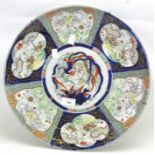 A 20th century ceramic charger, of circular form,
