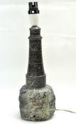 A vintage Cornish Serpentine table lamp in the form of a lighthouse,