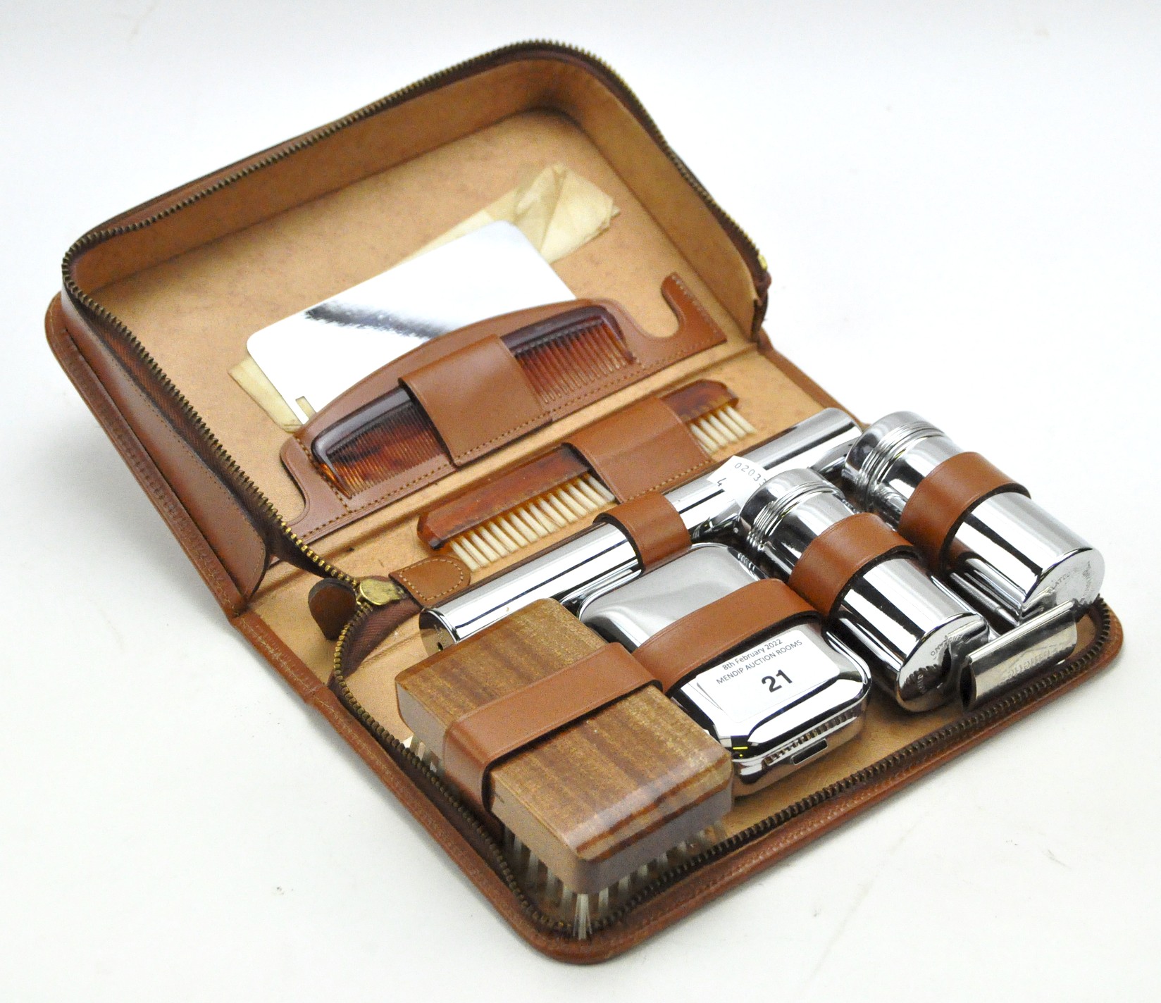 A leather cased travelling vanity set,