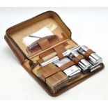A leather cased travelling vanity set,