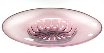 A large coloured glass dish of circular form,