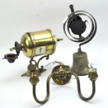 Two brass wall bracket light fixtures and a bell,