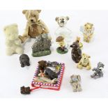 A large selection of teddy bear collectables, including two black forest carved wooden figures,