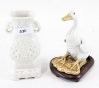 A 20th century glazed ceramic oriental gourde vase and a figure of a duck,