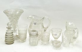 A collection of glassware, including beakers, jugs, a scent bottle,