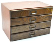 A contemporary four drawer tabletop chest of drawers,