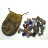 A collection of early glass marbles,