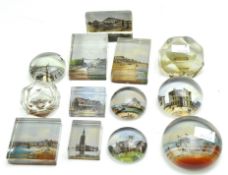 A collection of early 20th century glass paperweights, all featuring British tourist destinations,