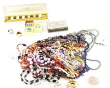 A collection of costume jewellery, including chains, brooches, necklaces, pendants and more,