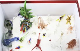 A collection of contemporary glass animals, including birds, fish,