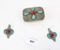 A pair of Mexican drop earrings and matching belt buckle,