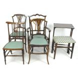 Four mahogany chairs with cross grain details, an occasional table and a stool.