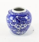 A Chinese blue and white ceramic ginger jar, with cherry blossom decoration, lacking lid,