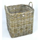 A large twin handled wicker storage basket,