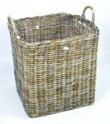 A large twin handled wicker storage basket,